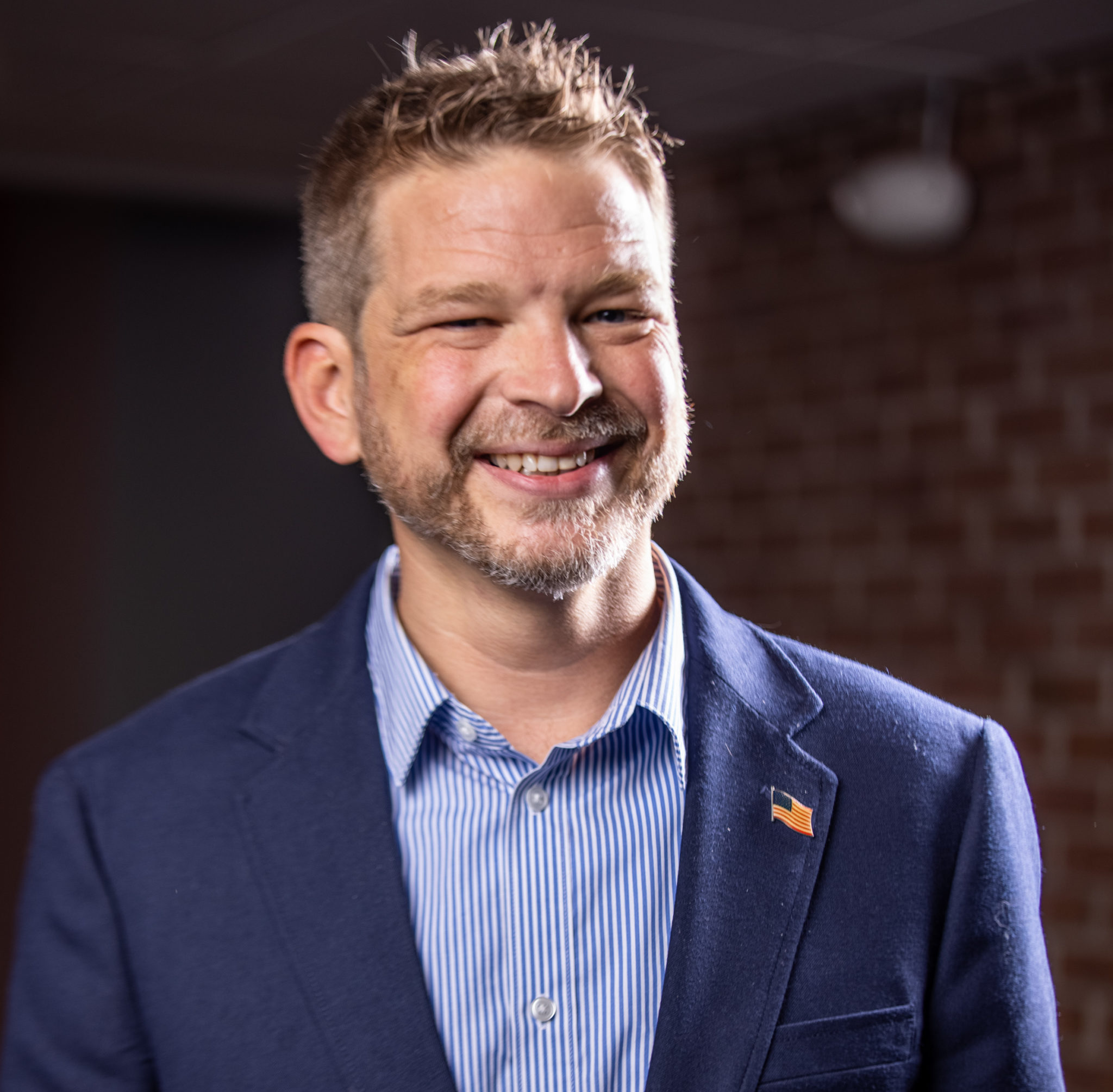 headshot of man smiling